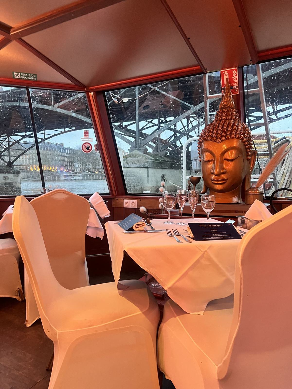 A table near the bow and its golden statue