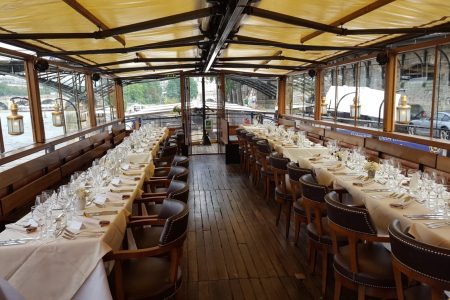 The large glass-walled dining room on Le Calife’s upper deck